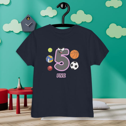 Navy Blue Kid's Shirt designed with number 5 and with 5 different kinds of balls in room with clouds background