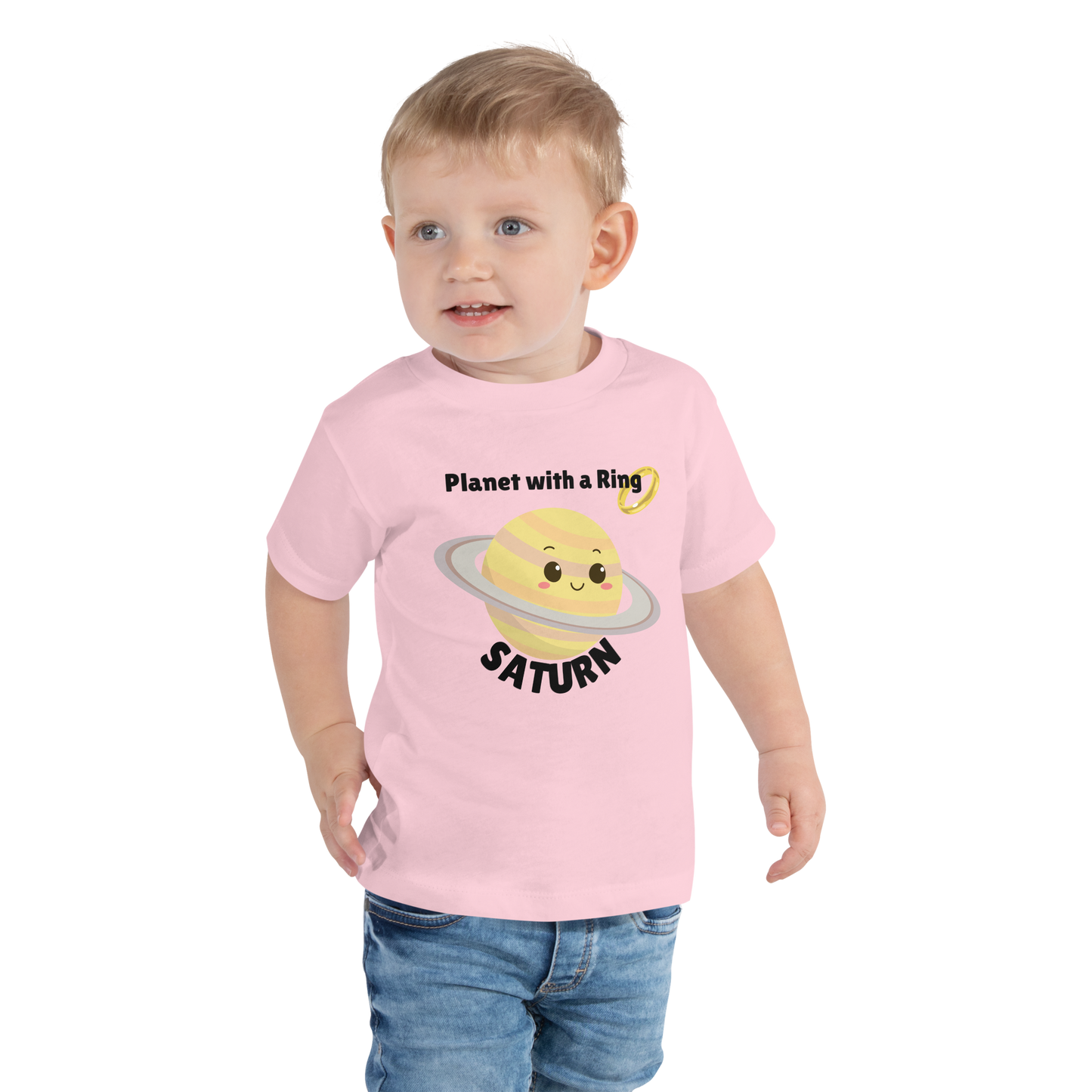 Child wearing a pink t-shirt with bold 'Saturn' text, Saturn graphic, and 'Planet with a Ring' subtext on a transparent background
