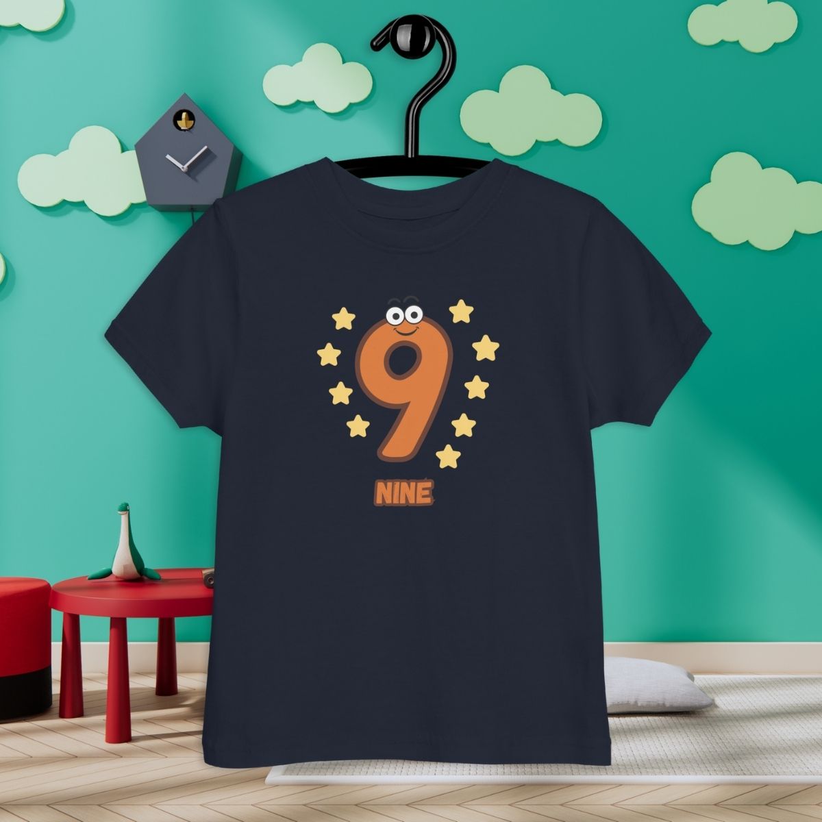 Navy Blue Kid's Shirt designed with number 9 with 9 stars in room with clouds background