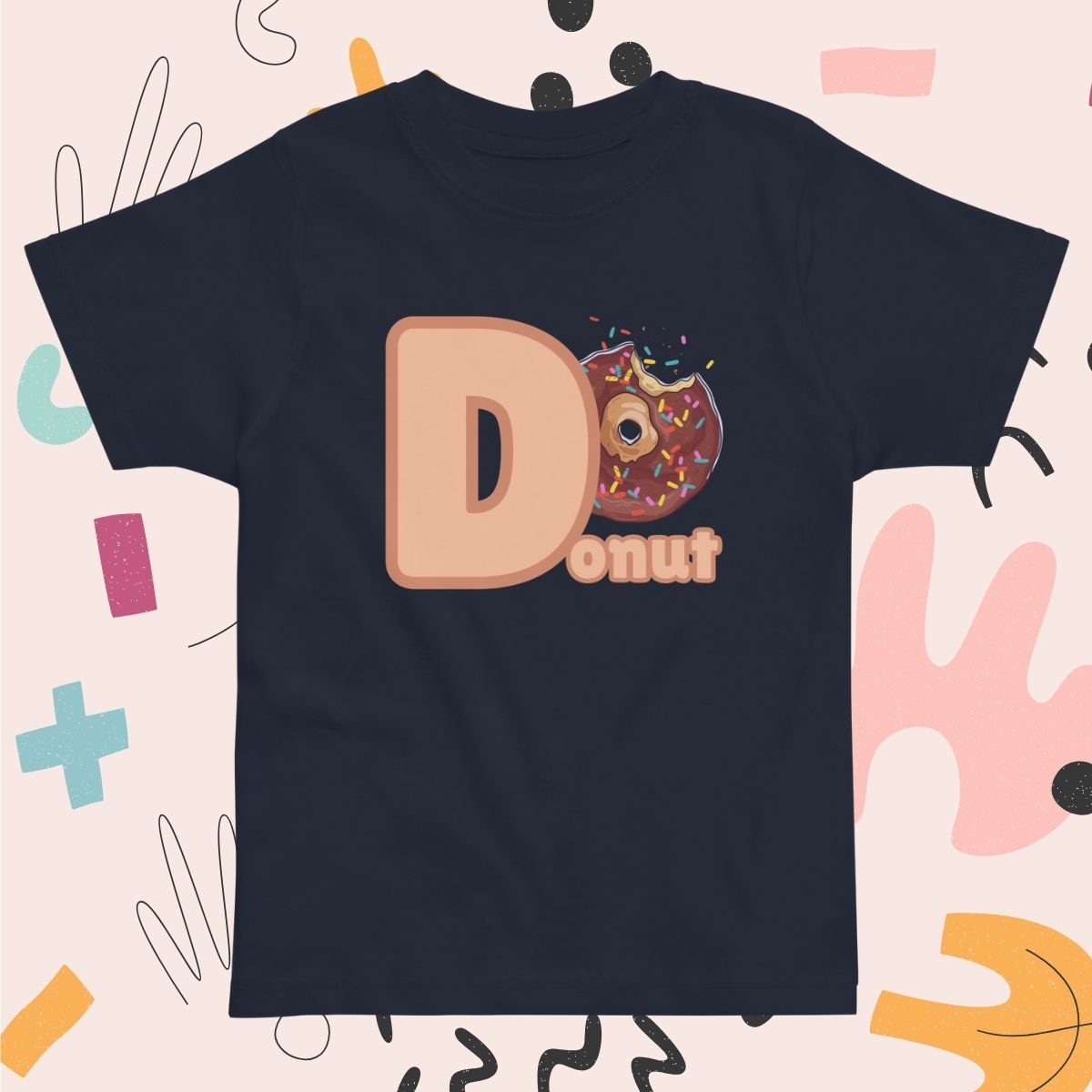 Toddler navy blue shirt designed with Donut image and text on playful pink background