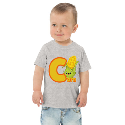 Child wearing a gray shirt designed with Corn image and text on white background