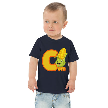 Child wearing a navy blue shirt designed with Corn image and text on white background