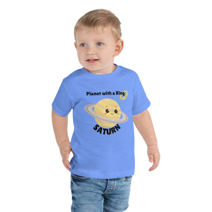 Child wearing a blue t-shirt with bold 'Saturn' text, Saturn graphic, and 'Planet with a Ring' subtext on a transparent background