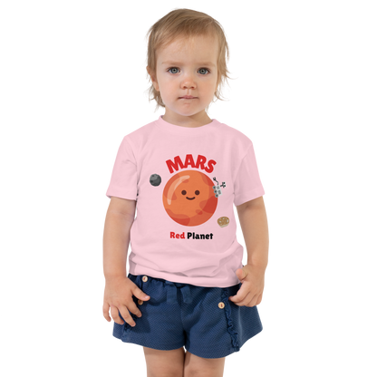 Child wearing a pink t-shirt with bold 'Mars' text, Mars graphic, and 'Red Planet' subtext on a transparent background
